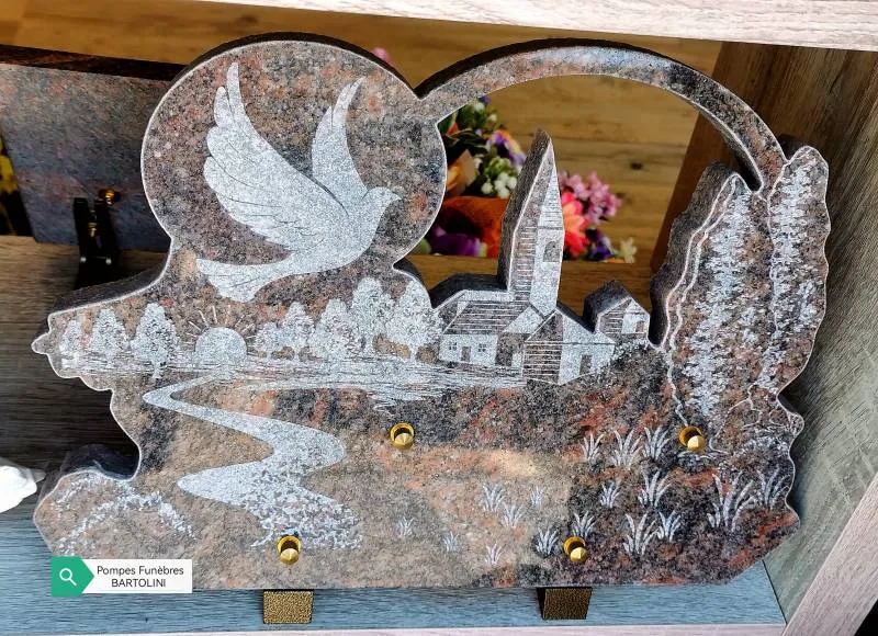 Plaque funéraire en granit sculptée en forme de paysage avec colombe et église