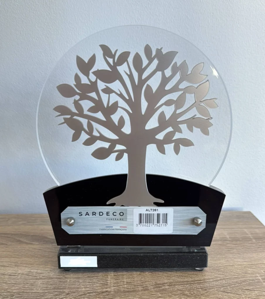 Plaque funéraire ronde translucide motif arbre de vie argenté sur socle noir